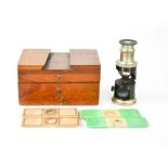 A pocket microscope by Thompson & Co Mathematical Instrument Makers of Liverpool, with four slides