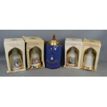 Five boxed Bells whisky commemorative decanters, four are unopened