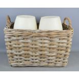 A wicker log basket and a pair of large oversized candles 44cm high.