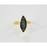 An 18ct gold, onyx and sardonyx signet ring, the marquise onyx black intaglio depicting a female