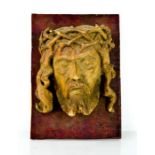 A 19th century carving of the head of Christ.