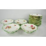 A part set of dinner plates and four comports.