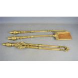 A group of Victorian brass fire irons