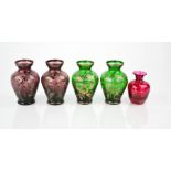 Two pairs of coloured glass and silver gilt bohemian bud vases.