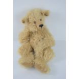 A 'Monty' teddy bear, by Hermann 263/2000, fully jointed, with certificate, 42cm tall.