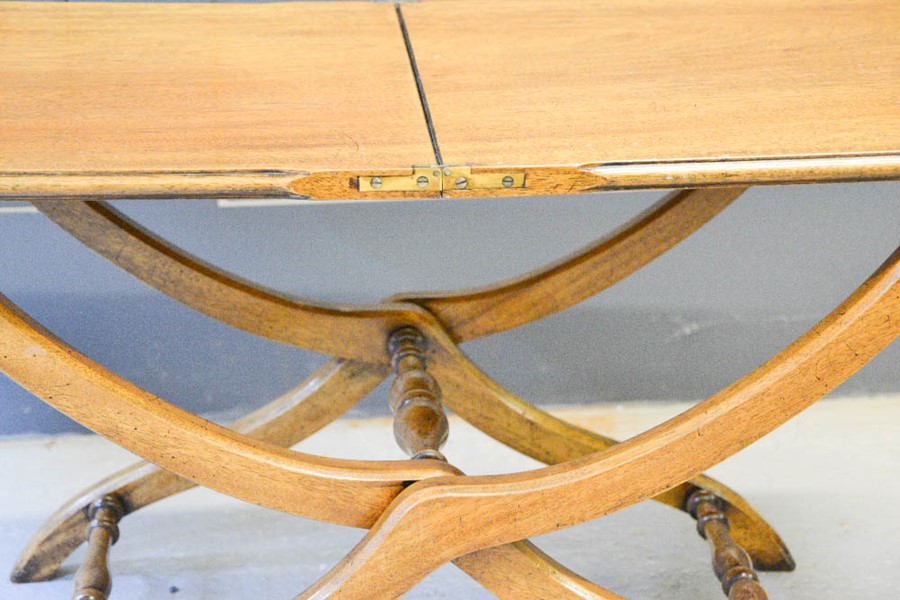 A mahogany folding coffee table. - Image 2 of 2