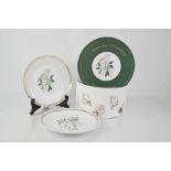 A set of John Lewis Christmas plates depicting the Twelve Days of Christmas.