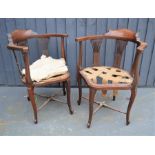 A pair of Edwardian inlaid corner chairs