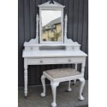 An Edwardian pine dressing table with stool
