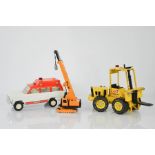 A group of vintage Tonka toys to include a forklift
