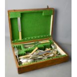 A part canteen of cutlery in an oak case.