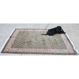 A Qum rug, made in Iran, 135cms x 196cms