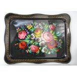A Russian hand painted tin tray, signed and depicting flowers, 47 by 33cm.