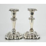 A pair of 19th century silver candlesticks, with weighted bases, removable candle sockets.