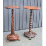 A Victorian rosewood table with fluted column and claw feet together with another example