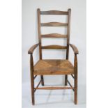 Two Edwardian chairs including an oak rush seat ladderback.