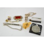 A silver lighter holder, a silver ½oz pendant and chain, brooches and other items.