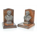 A pair of William Shakespeare cast metal and oak bookends
