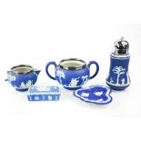 A group of blue Wedgwood pottery, including a sifter, trinket box and dish.