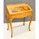 A French satinwood bureau, the fall front painted with a figural scene enclosing a fitted