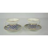 A pair of Imperial porcelain cups and saucers.