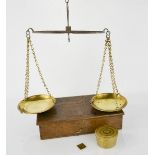 A boxed set of sovereign scales complete with weights and Royal Mint weights.