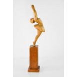 A wooden model ballerina raised on plinth, 41cm high.