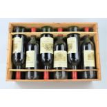 A case of twelve bottles of 1981 Chateau Magdelaine - Saint Emilion grand cru classe red wine