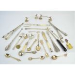 A quantity of spoons , glove stretchers, latch hook, to include some silver examples