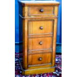 An oak set of graduated drawers, with marble top.