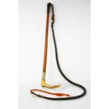 A 19th century malacca cane hunting whip with horn handle.