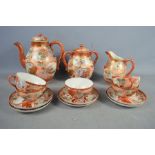 A Japanese porcelain part tea set