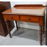 A Victorian mahogany dressing table with glass top, and single drawer, turned legs.
