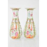 A 19th century Canton pair of lobed vases, decorated with birds and figures, with makers mark to the