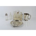 A silver plated cruet set, tankard, bottle and sifter.