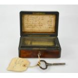 A rare 19th century French miniature music box, for six songs, in a burr wood box, with key, 5 by 13