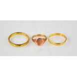 A 9ct (tested) rose gold signet ring, 1.04g, together with two further rings.