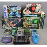 A quantity of vintage electronic games to include a boxed Gameboy, Binatone tv game mk6, Galaxy