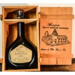 A bottle of Grand Armagnac, 1942, 70cl, in the original presentation crate.