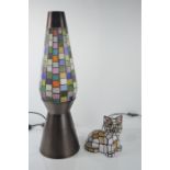 A stained glass style lamp, together with one in the form of a cat.