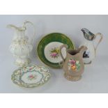 A group of ceramic jugs and bowls to include a Coalport bowl raised on three feet with floral sprays
