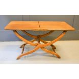 A mahogany folding coffee table.