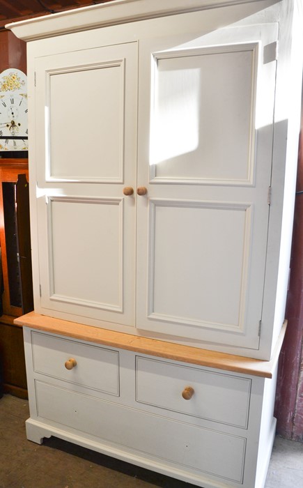 A modern housekeepers cupboard with drawer to the base, 210 by 124 by 60cm.