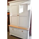 A modern housekeepers cupboard with drawer to the base, 210 by 124 by 60cm.