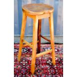 A bar stool, and an oak bench.