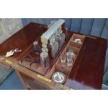 A Stewart Dawson & Co of Hatton Gardens mahogany liquor cabinet, complete with glasses and