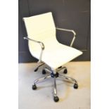 A white Eames-style desk chair