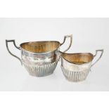 A silver sugar bowl and milk jug, London 1898, 10.43toz.