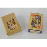 Two vintage boxed miniature playing cards.