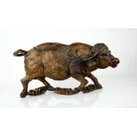 A Chinese 19th century hardwood carved water buffalo.- 23cm h x 47cm